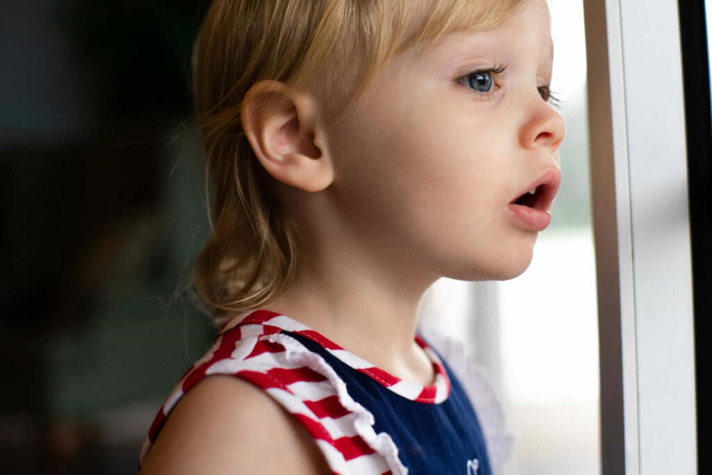 5 Tips for Choosing a Pediatric Dentist in Hawthorne, CA 4 little girl looking out the window at hawthorne childrens dental