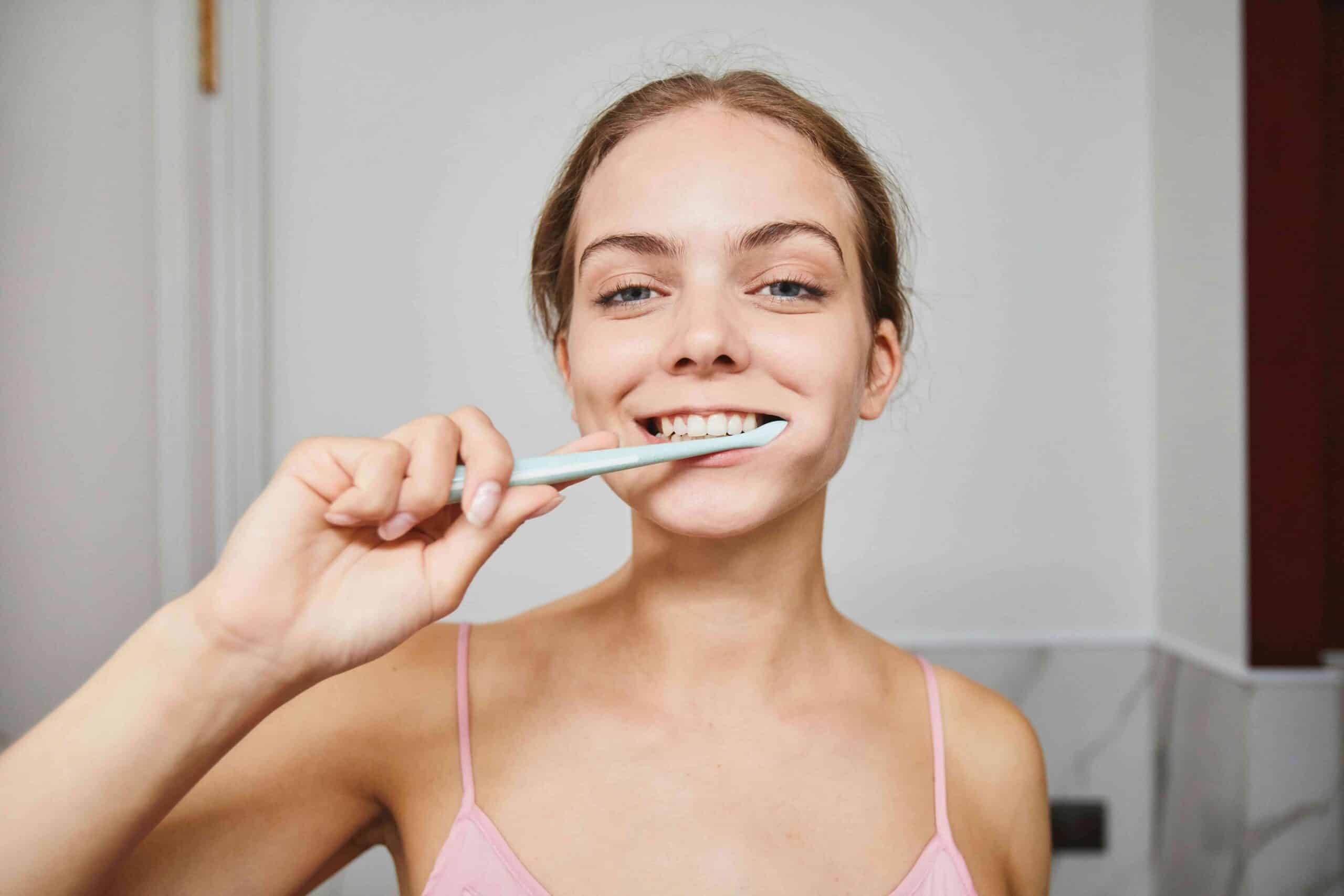 The Science of Fluoride: How It Protects Your Child’s Smile 5 girl brushing her teeth