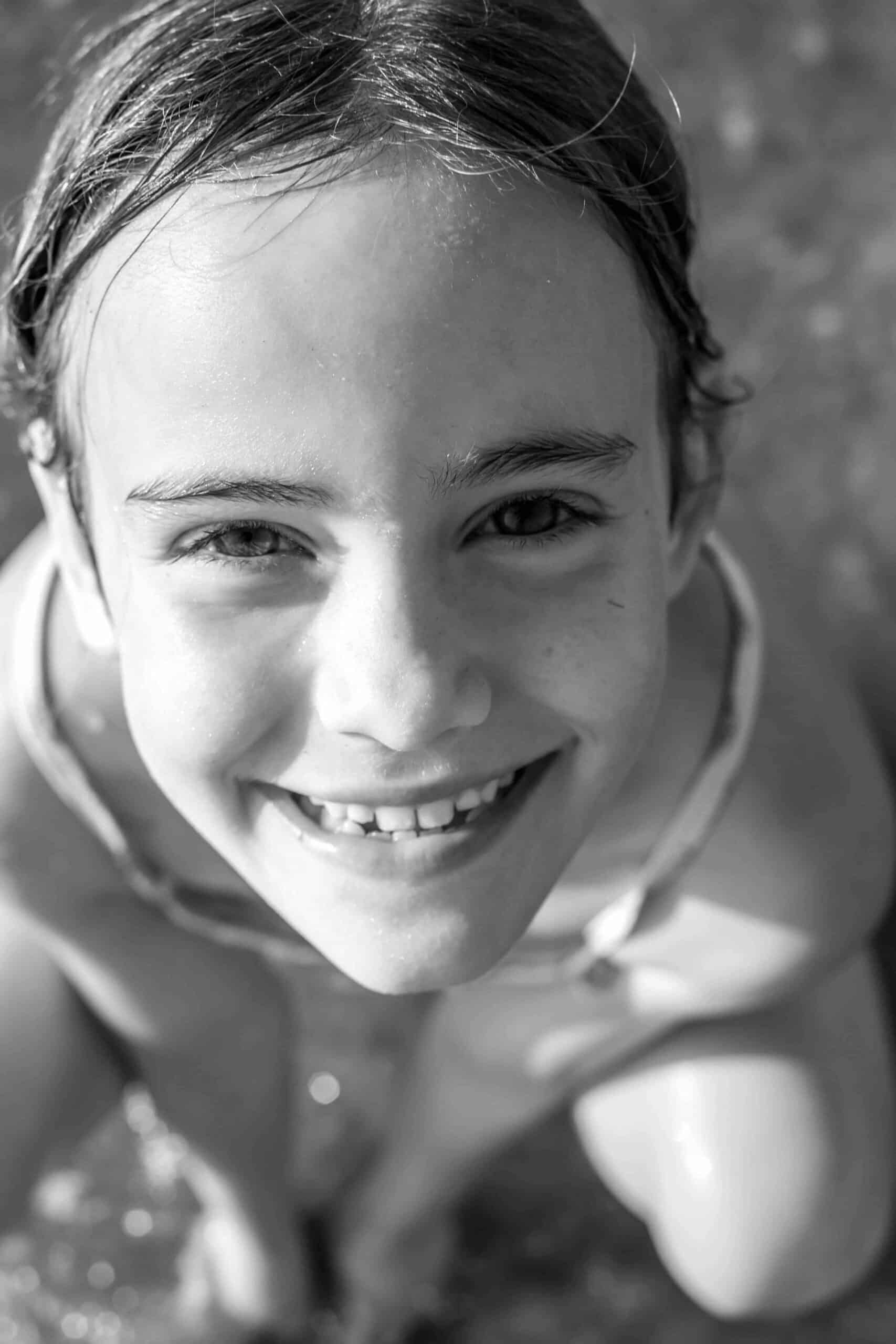 Why Families Trust Hawthorne Children's Dental in California 5 black and white photo of young girl smiling