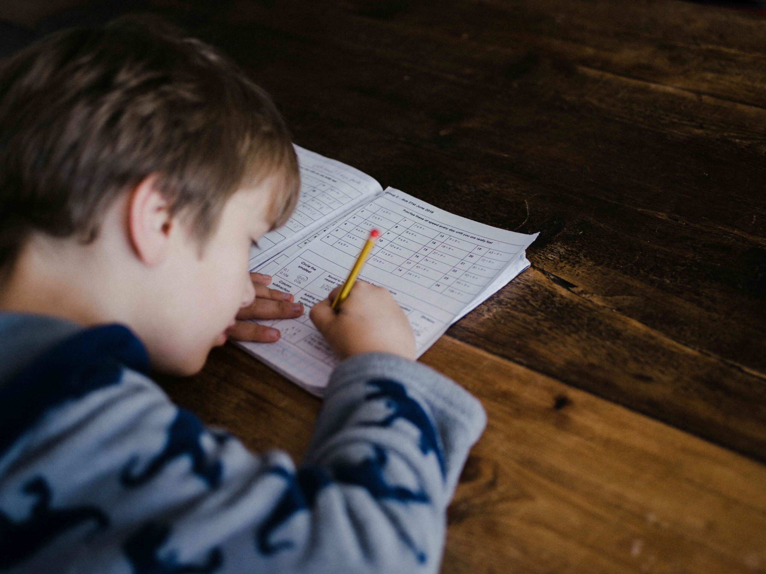 Preparing for the School Year: An Inglewood Parent's Dental Guide 4 young boy writing on paper in school